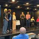 Integrantes da Secult e do Circolo Italiano di Joinville no palco do auditório